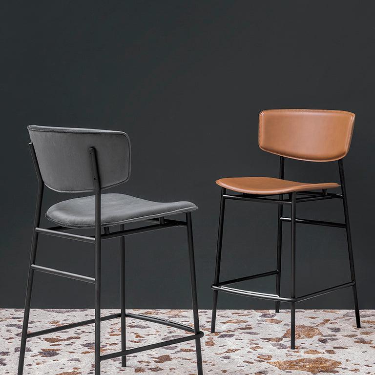 FIFTIES upholstered bar stool with a black base