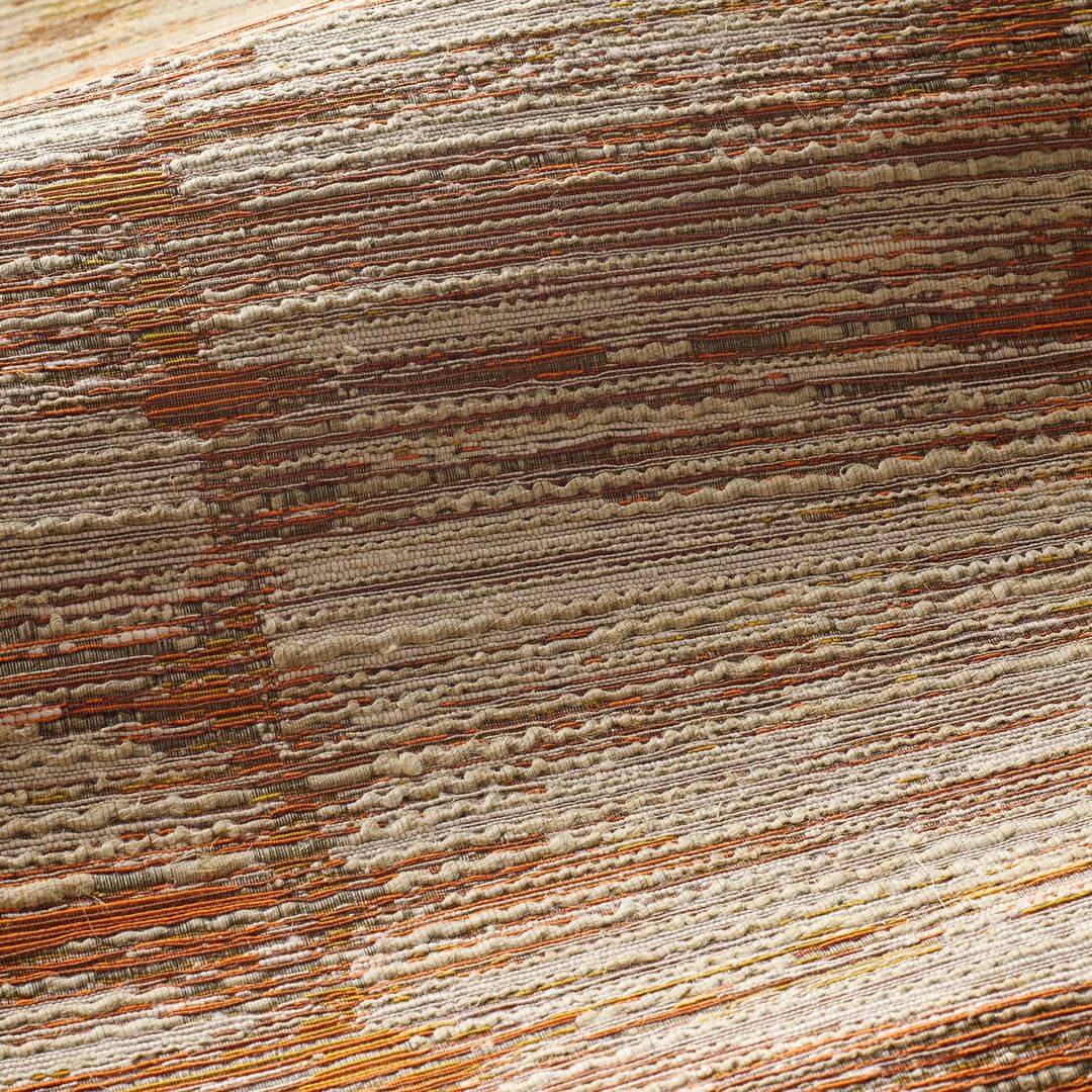 Textile wallpaper with a structural stripe design ALCHEMILLA - ORANGE BRÛLÉ/ROASTED ORANGE with beige