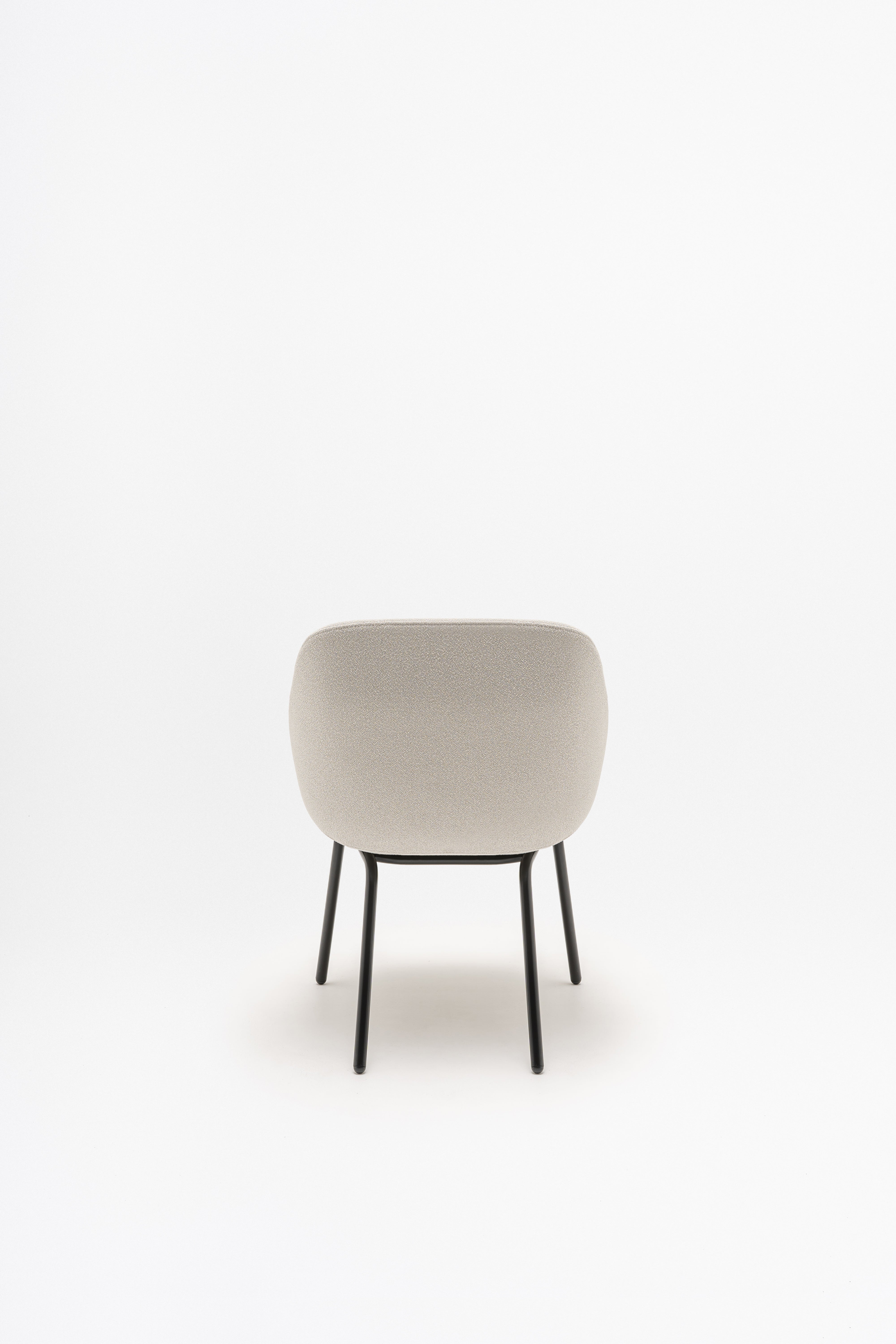 Armchair with low backrest parallel four -legged base