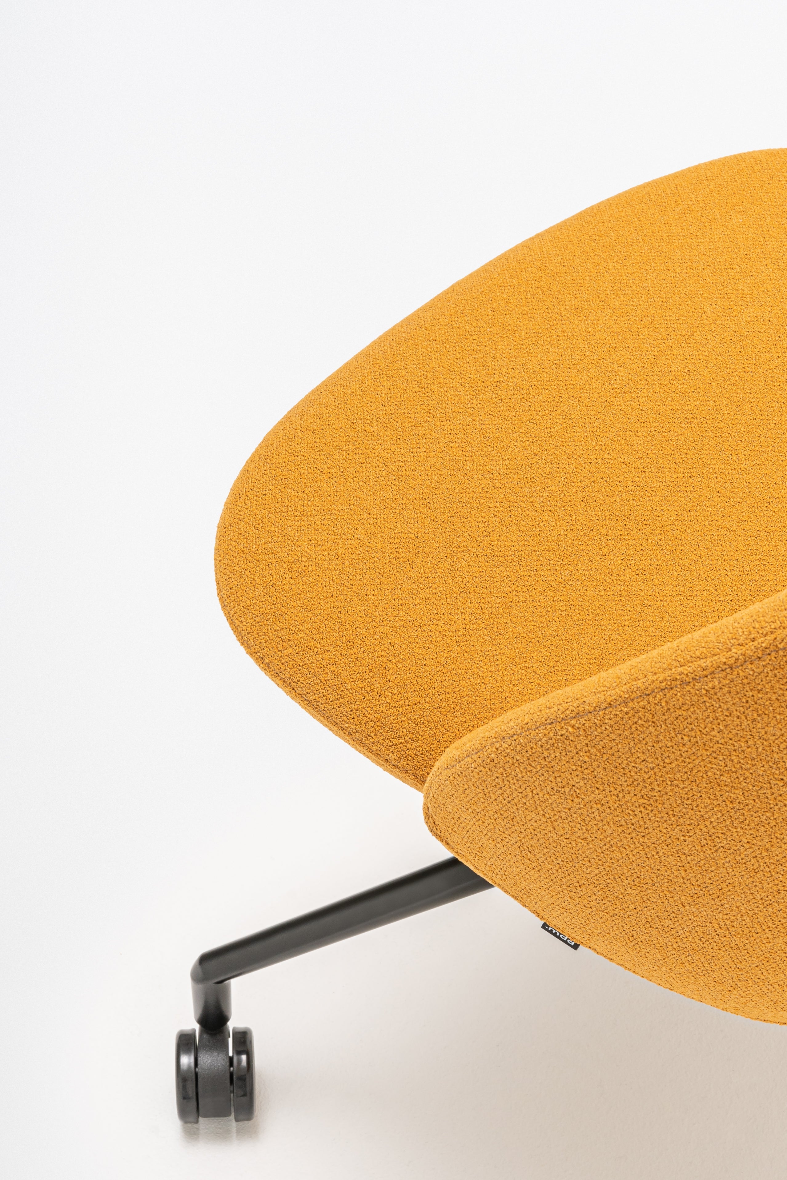 Rotable armchair with a high back parallel metal base with wheels to a hard surface