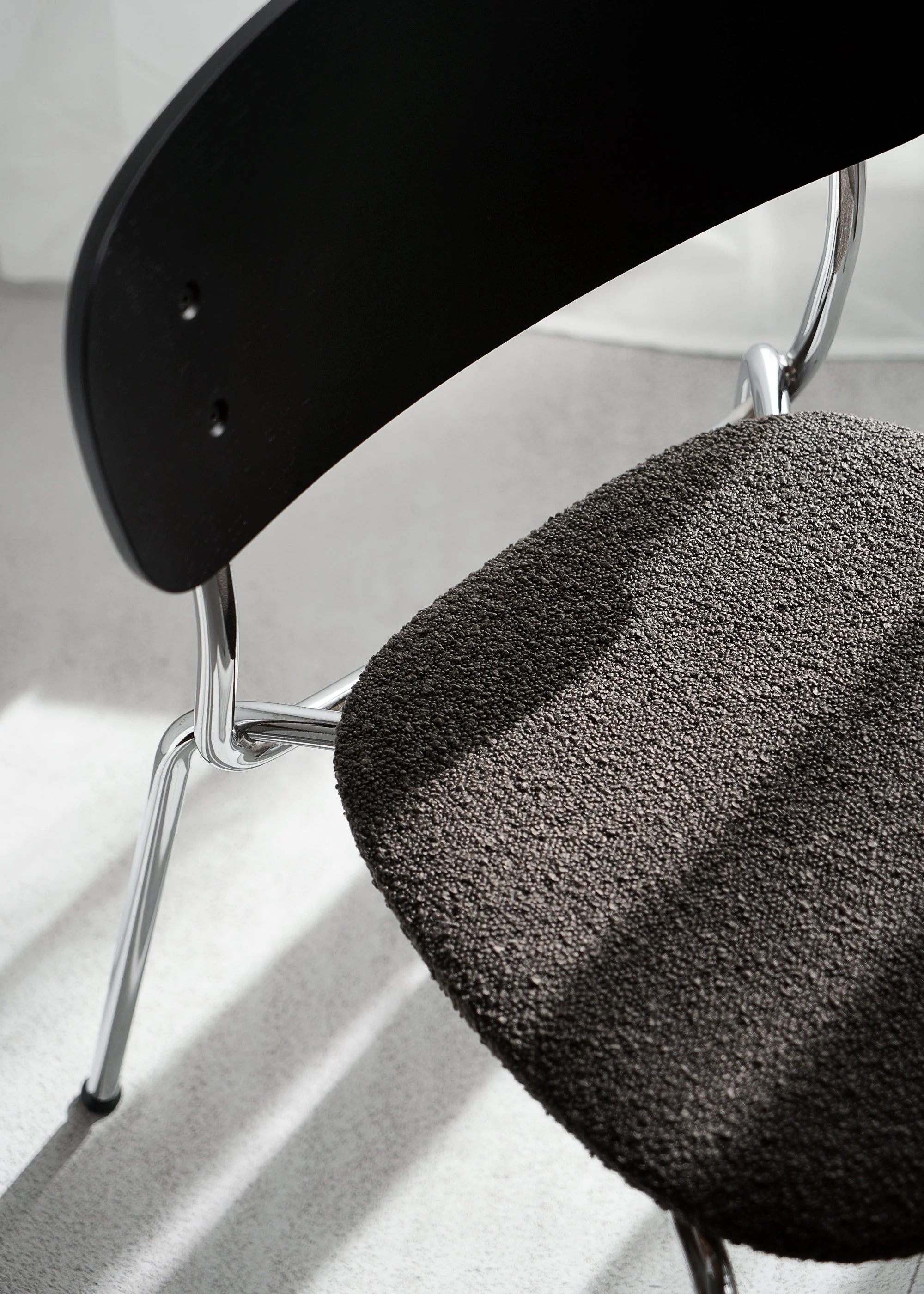 SPLIT SOFT chair black oak wood with chrome base and black bouclé