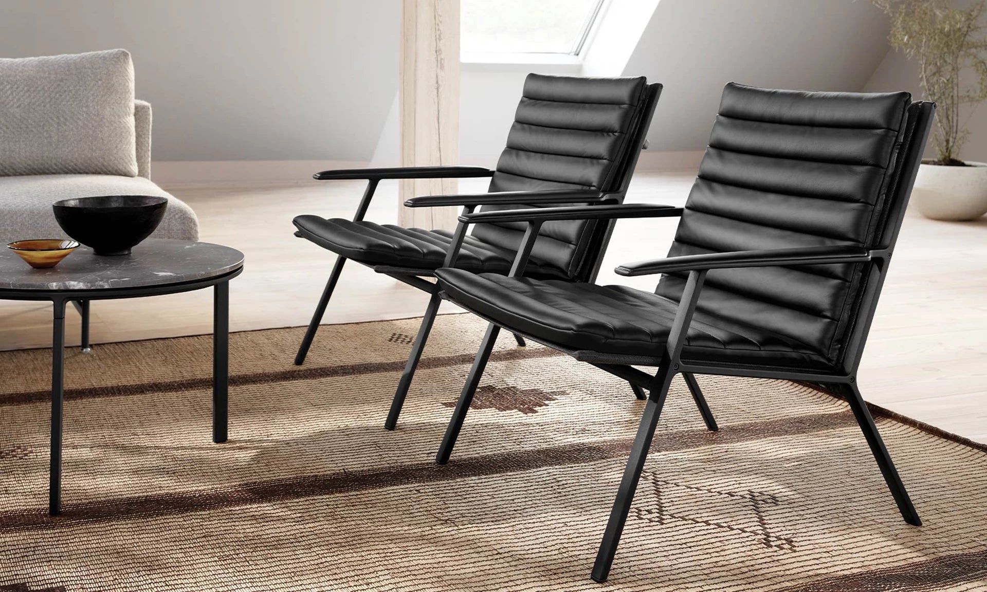 Armchair 456 black leather with dark metal base