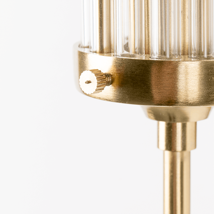 Modern acrylic design tubes are complemented by a matte brass wall finish. Thanks to our fashionable Angel On Fire wall lamp, you can softly and stylishly illuminate the wall in the gallery or add the glow of empty wall space. Style that